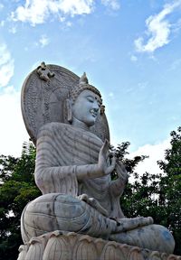 Low angle view of statue against sky