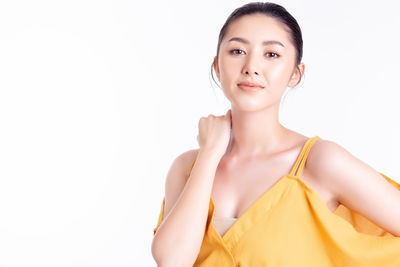 Portrait of a beautiful young woman over white background