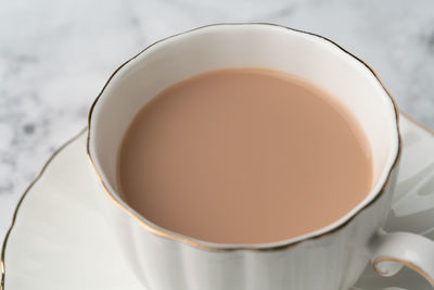 Close-up of coffee cup on table