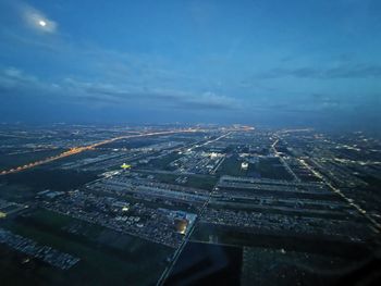 Aerial view of illuminated buildings in city at night