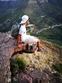 Hiker resting on top of mountain at lions head