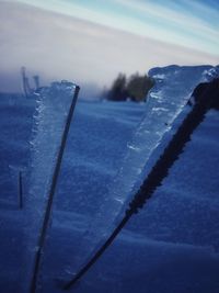 Close-up of frozen sea against sky