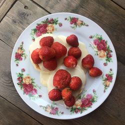 High angle view of strawberries in plate on table
