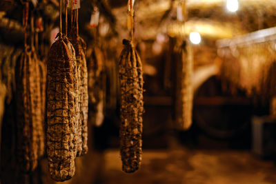 Close-up of hanging for sale in market