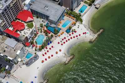 High angle view of street by buildings in city