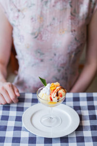 Midsection of woman having icecream