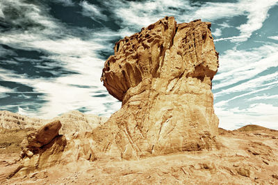 Rock formation on land against sky