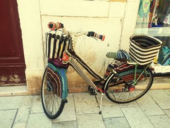 Bicycle parked against wall