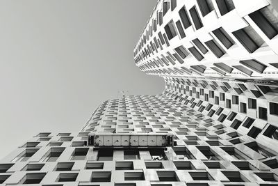 Directly below shot of building against clear sky