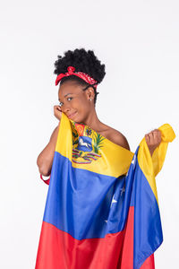 Portrait of smiling young man against white background