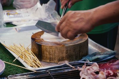 Cropped image of man working on table