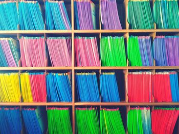 Full frame shot of multi colored files in shelves