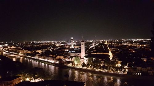 High angle view of illuminated buildings in city at night