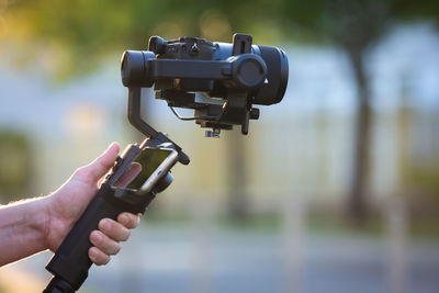 Close-up of hand holding camera