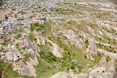 High angle view of trees and buildings in city