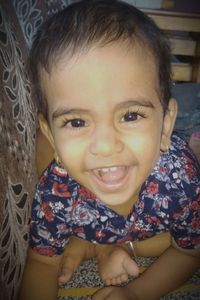 Close-up portrait of smiling boy