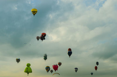 Low angle view of hot air balloons against sky