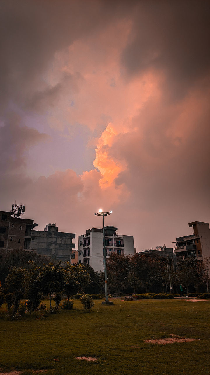 SCENIC VIEW OF BUILDINGS AGAINST SKY DURING SUNSET