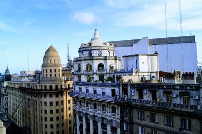 Buildings in city against sky