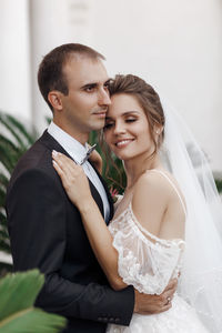 Portrait of bride holding bouquet