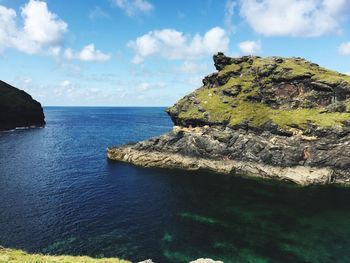 Scenic view of sea against cloudy sky