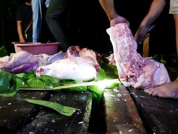 Midsection of people preparing food