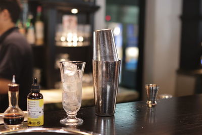 Close-up of wine glasses on table