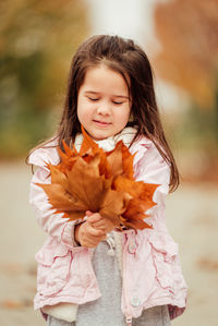 Portrait of a girl standing outdoors