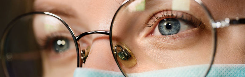 Close-up of woman wearing eyeglasses