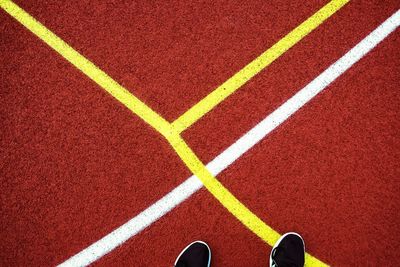 Low section of person on sports track