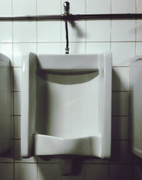 Low section of man standing in bathroom