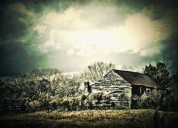 House on landscape against sky