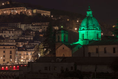 Illuminated buildings in city at night