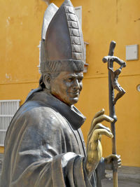 Close-up of statue against building