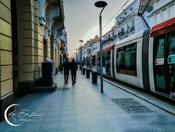 People on train in city