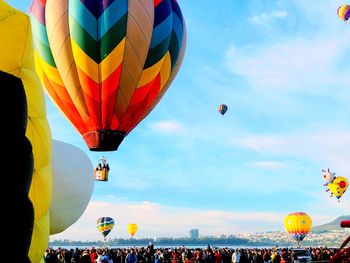 Low angle view of hot air balloons against sky