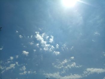 Low angle view of sun in sky