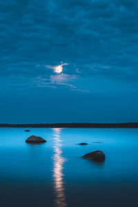 Scenic view of sea against sky at night
