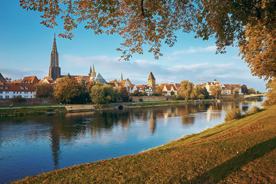 River amidst buildings against sky