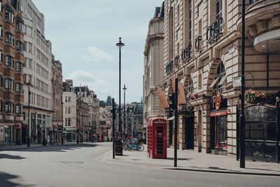 Street amidst buildings against sky