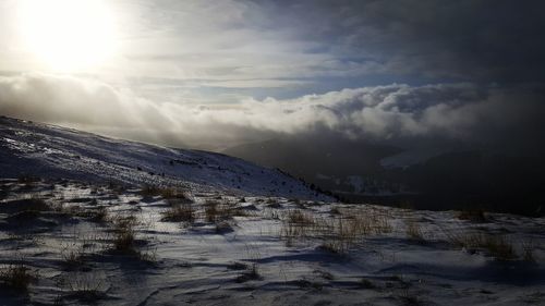 Scenic view of snowcapped mountains against sky