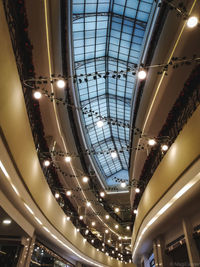 Low angle view of illuminated lights hanging from ceiling