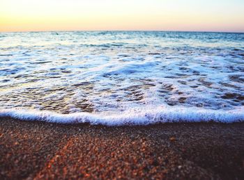 Scenic view of beach at sunset