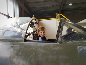 Portrait of boy smiling in car