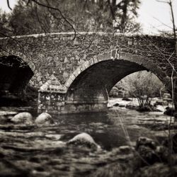 Arch bridge over river