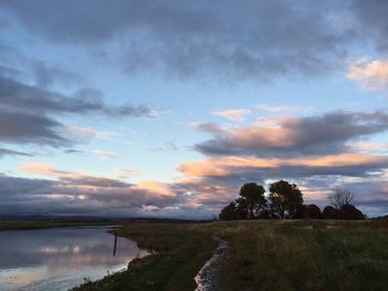 Scenic view of landscape against sky during sunset