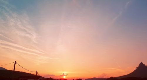 Low angle view of silhouette mountain against sky during sunset