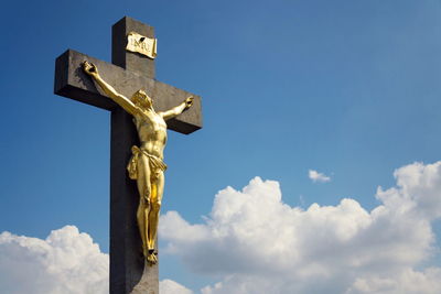 Low angle view of statue against sky