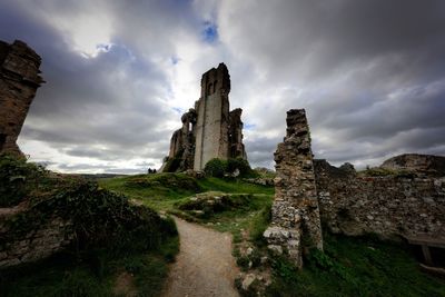 Old ruin building against cloudy sky