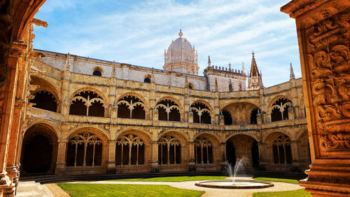 Facade of historic building against sky